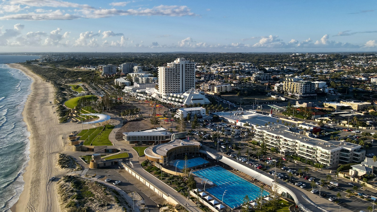 aerial view of city buildings during daytime by the coast